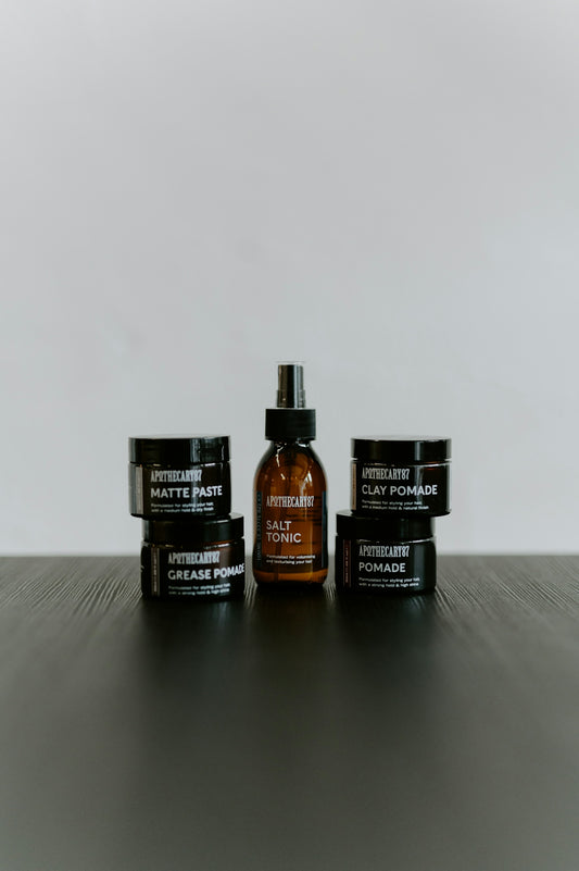 Hair styling products including pomade, paste, and tonic.